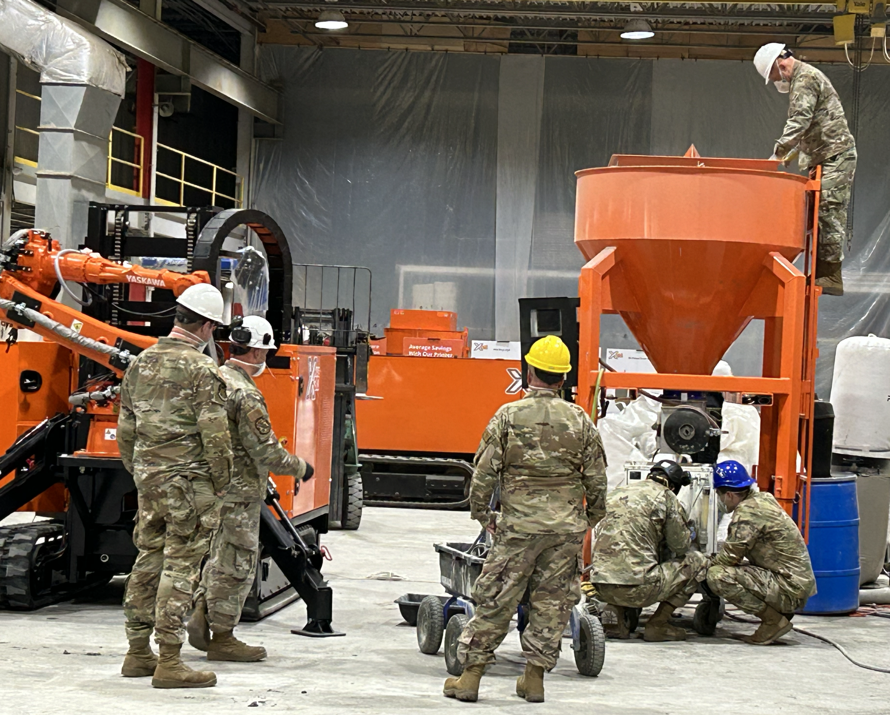 Guardsmen with Silo and Mixer Pump